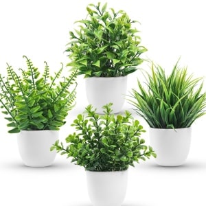 fake plants with white vases